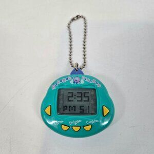 Vintage Rakuraku Dinokun Japanese Virtual Pet Aqua Green & Yellow Dinkie Dino